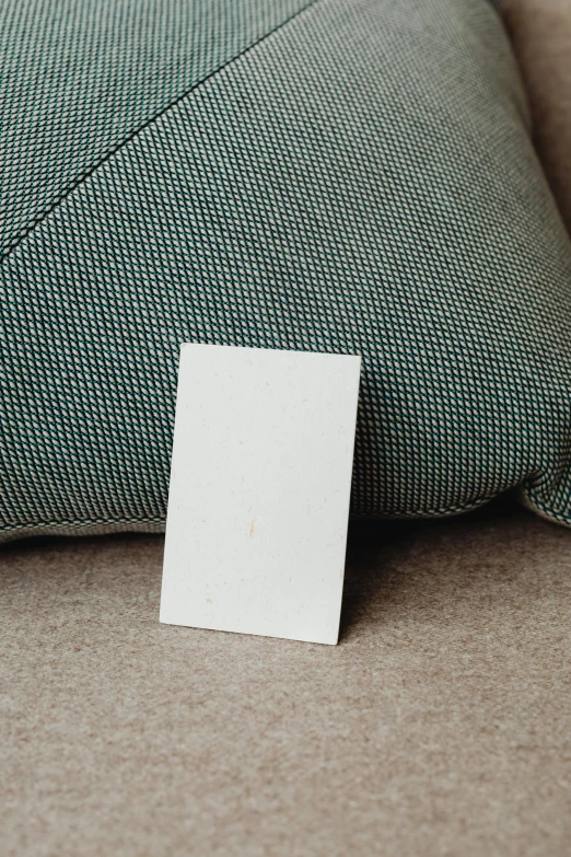 an old piece of paper lies on the cushion