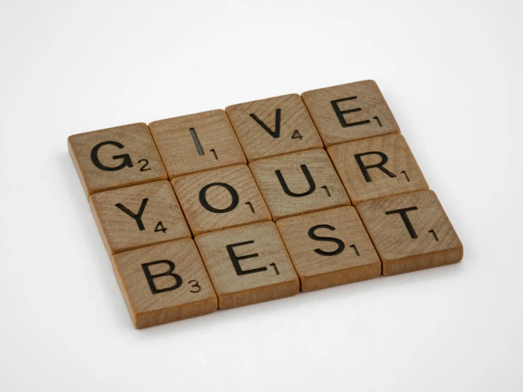 the word give your best spelled on a wooden cube