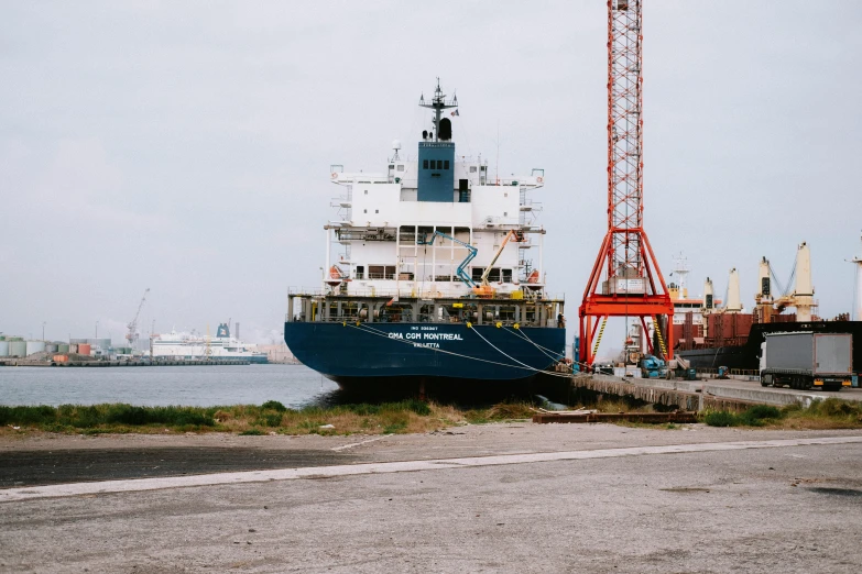 a large boat sitting on top of a body of water, a photo, pexels contest winner, hyperrealism, shipping docks, utilitarian cargo ship, portrait n - 9, 2 0 0 0's photo