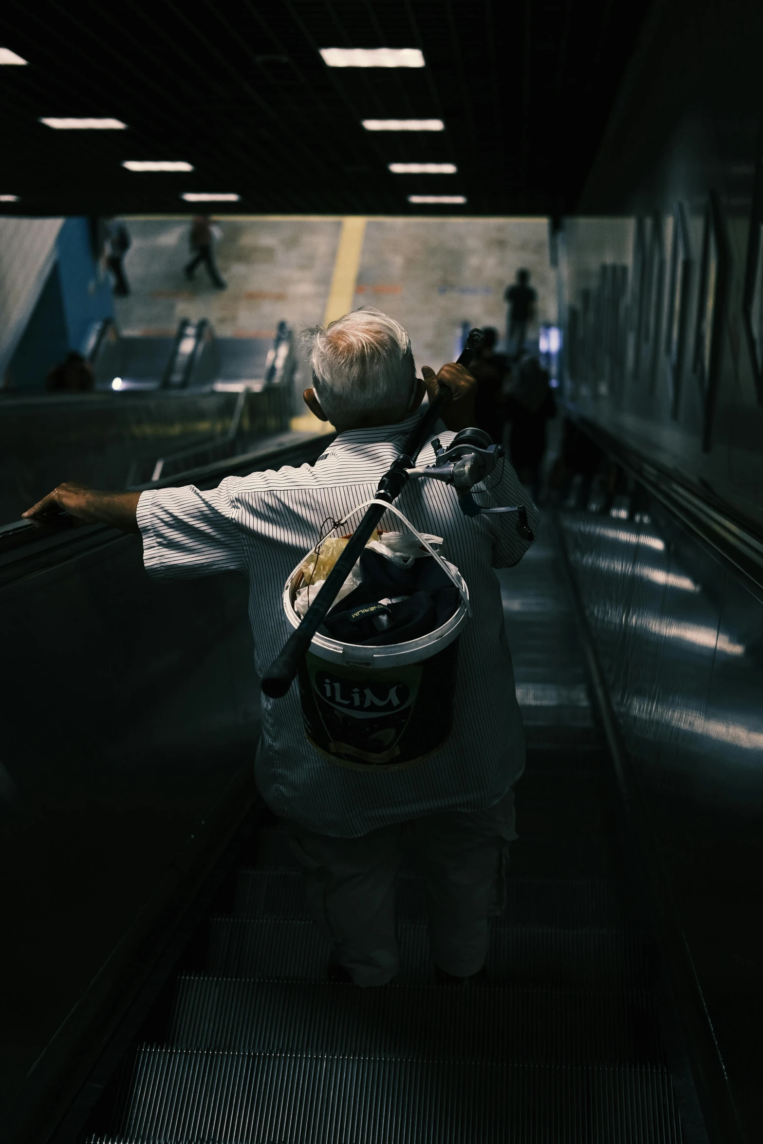 an image of someone riding on an escalator