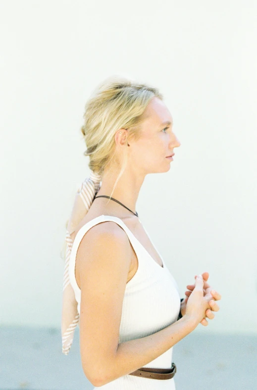 a woman standing on top of a beach next to the ocean, an album cover, by Sara Saftleven, unsplash, meditative sacral pose, in front of white back drop, beth cavener, profile image