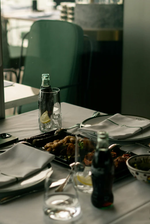 a laptop computer sitting on top of a table, by Matija Jama, unsplash, renaissance, on a plate in a busy diner, square, somber mood, moroccan