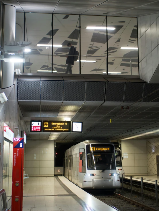 a subway train pulling into a station next to a platform, by Daarken, mirror and glass surfaces, vinyl on glazing, transparent, medium height