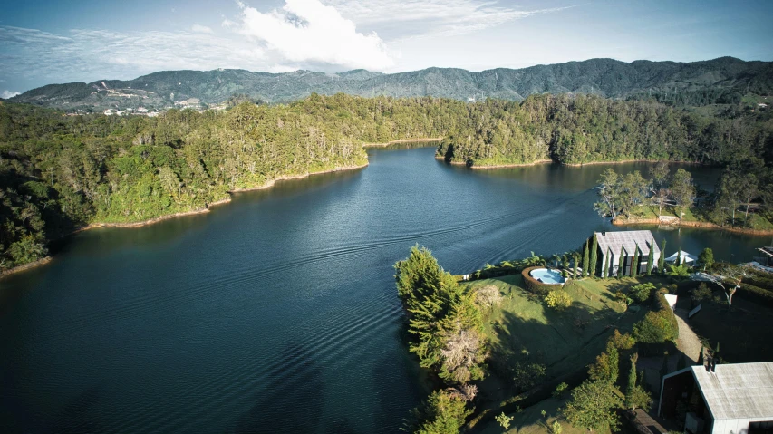 the lake is surrounded by forest and mountains