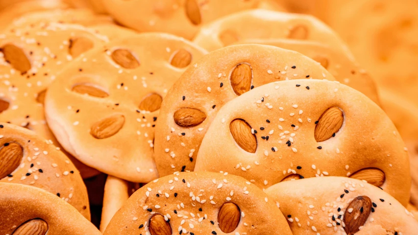 a bunch of pretzels sitting on top of each other, trending on pexels, art nouveau, sexy sesame seed buns, avatar image, background image