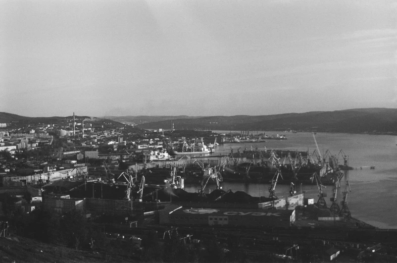 a black and white photo of a harbor, by Maurycy Gottlieb, fluxus, norilsk, overview, old footage, turkey