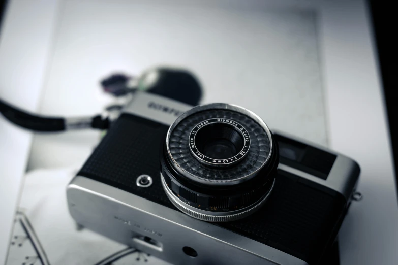 a black and white photo of a camera, a picture, by Adam Marczyński, unsplash, photorealism, colored analog photography, medium format, dieter rams, ((sharp focus))