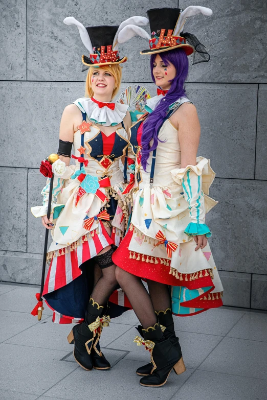 a couple of women standing next to each other, a photo, by Kamagurka, cg society contest winner, rococo, ornate cosplay, [[[[grinning evily]]]], circus, large)}]