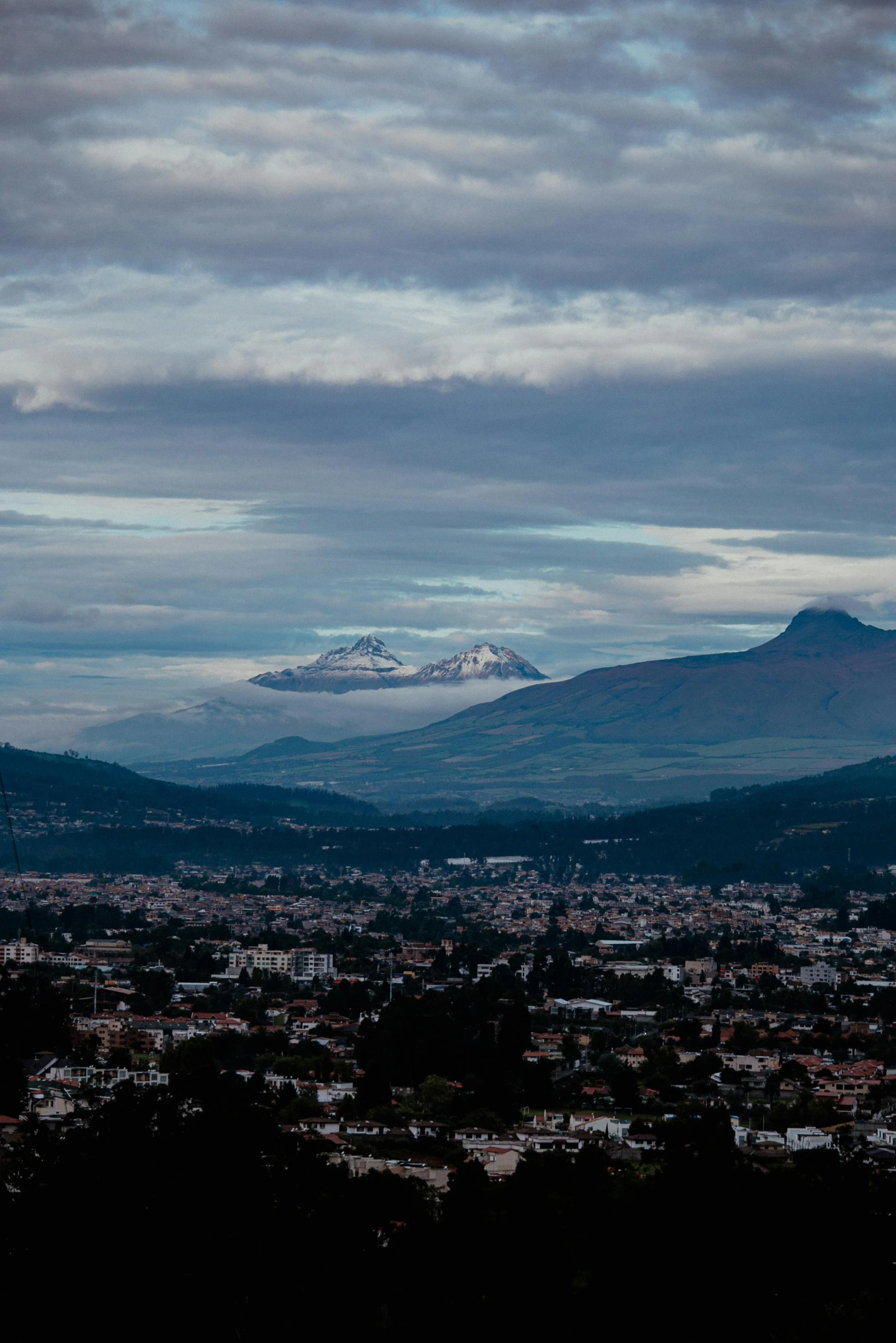 there is a snow capped mountain in the distance