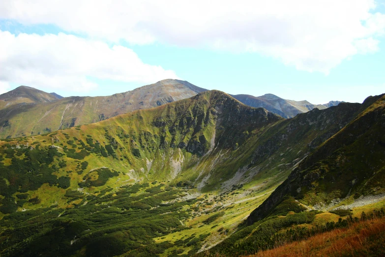 some hills on a bright sunny day on a bright, cloud covered day