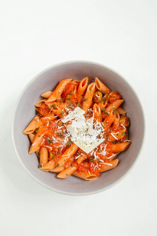 a bowl of pasta with sauce and parmesan cheese, by Will Ellis, coral red, 4l, high grain, inferno