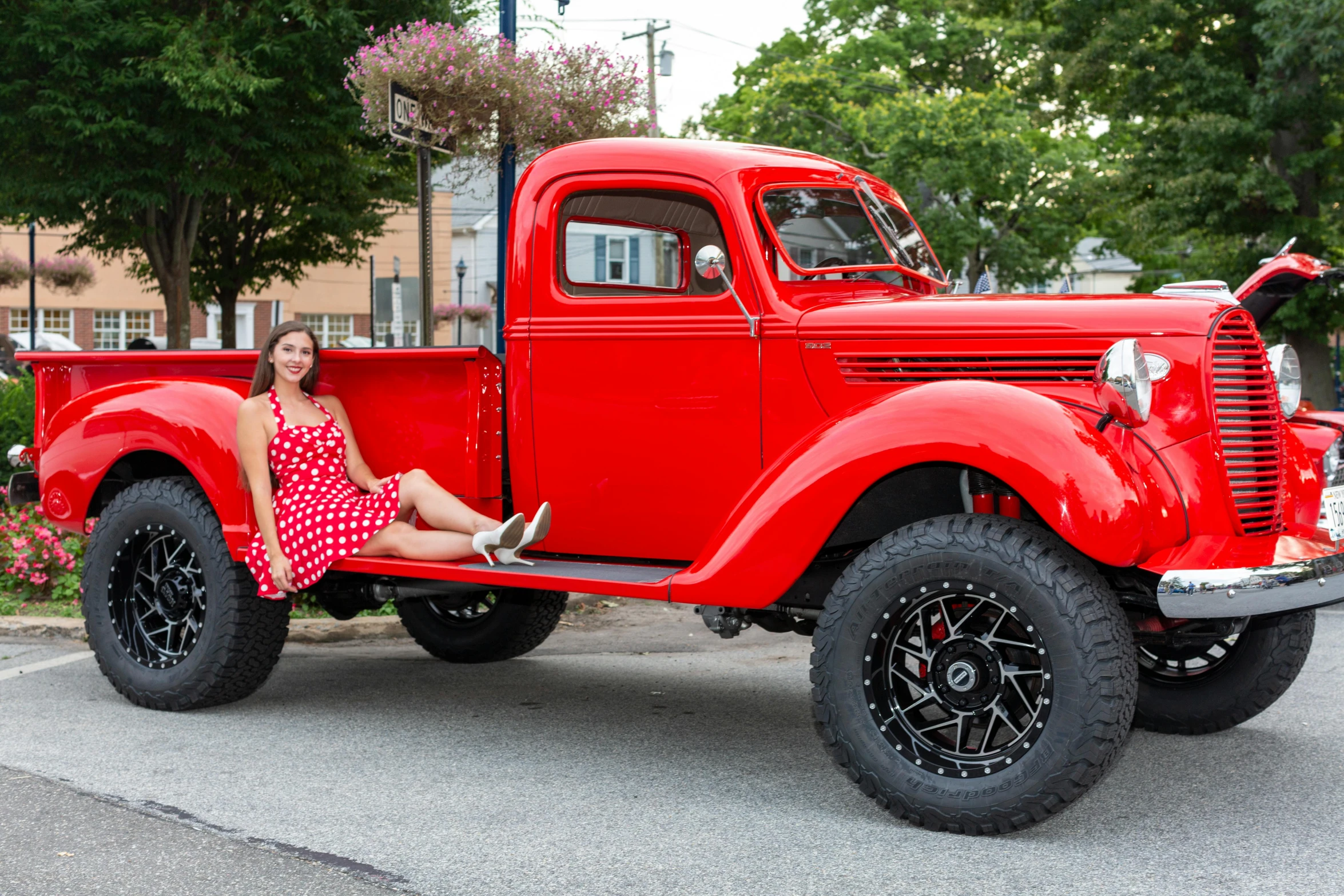 a woman sitting in the bed of a red truck, pexels contest winner, square, 15081959 21121991 01012000 4k, full body full height, 1940s