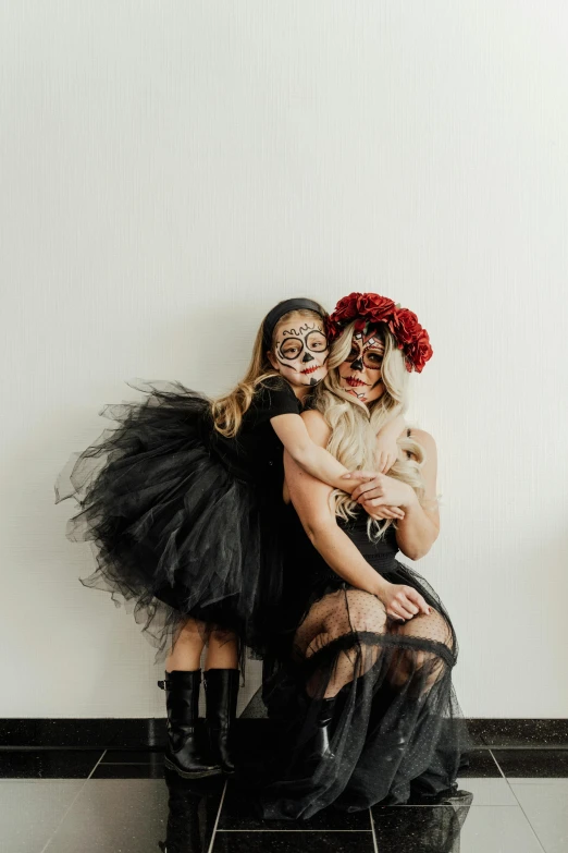 a couple of women sitting next to each other, reddit, kitsch movement, daughter of death, tulle and lace, black on white background, unsplash photo contest winner