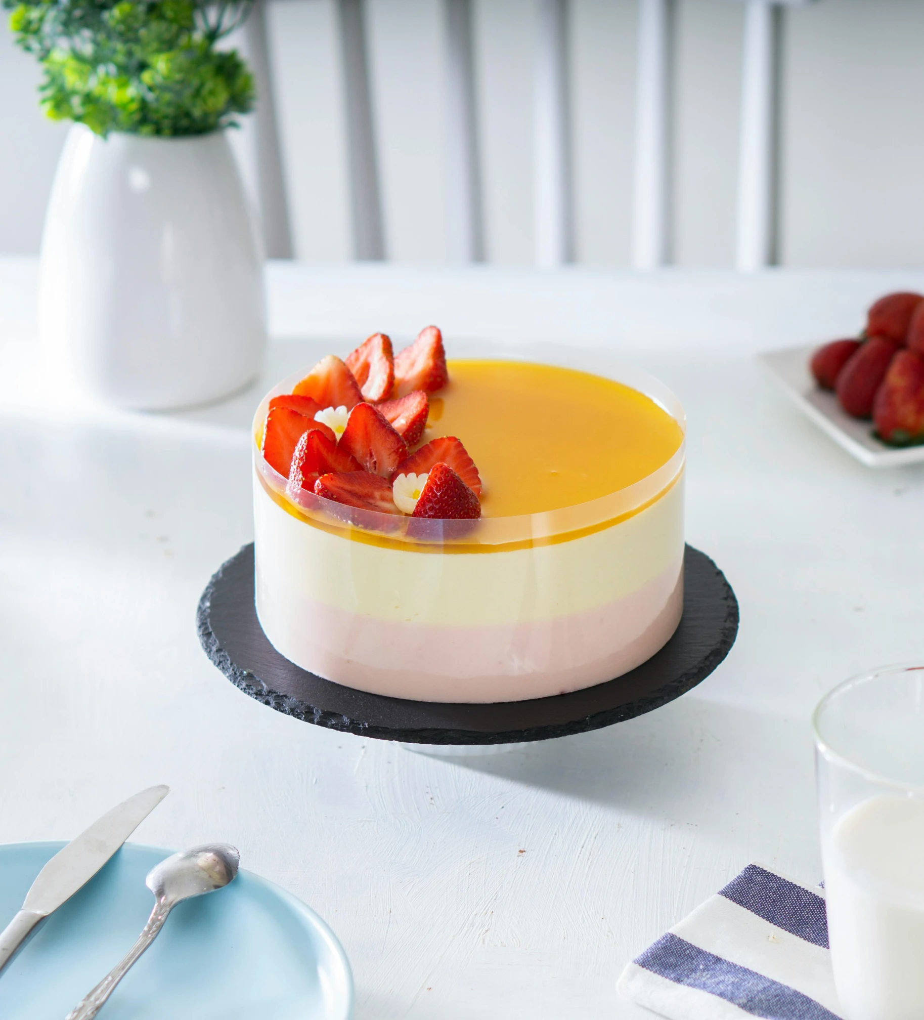 a cake sitting on top of a white table, a pastel, unsplash, hurufiyya, flan, semi-transparent, strawberry, murata range