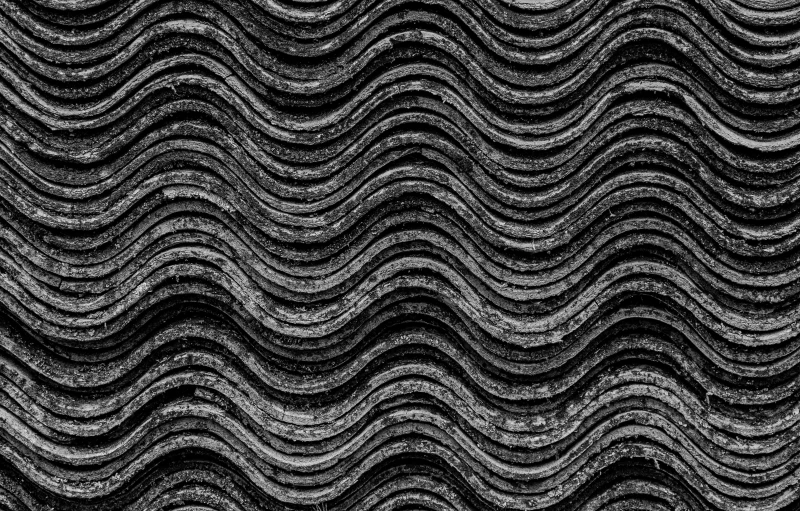 a black and white photo of a roof, a stipple, inspired by Edward Weston, unsplash, op art, rippling oceanic waves, tileable texture, carved black marble, lava texture