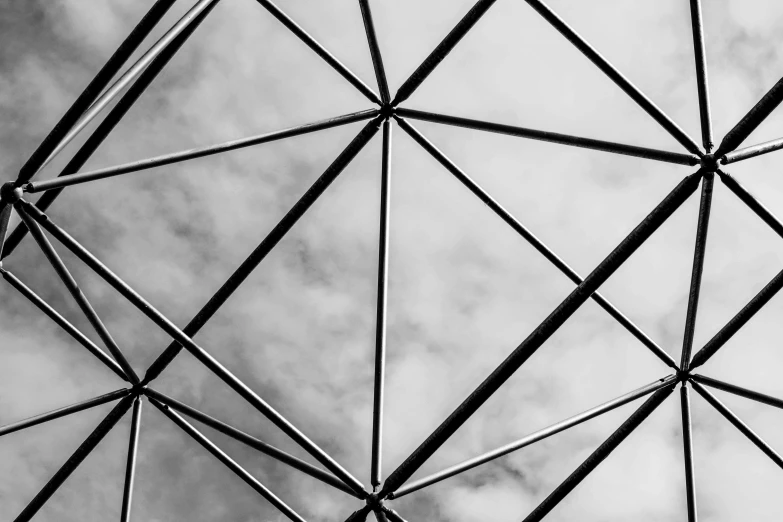 a black and white photo of a metal structure, inspired by Buckminster Fuller, unsplash, square, roof background, cloud, polygonal