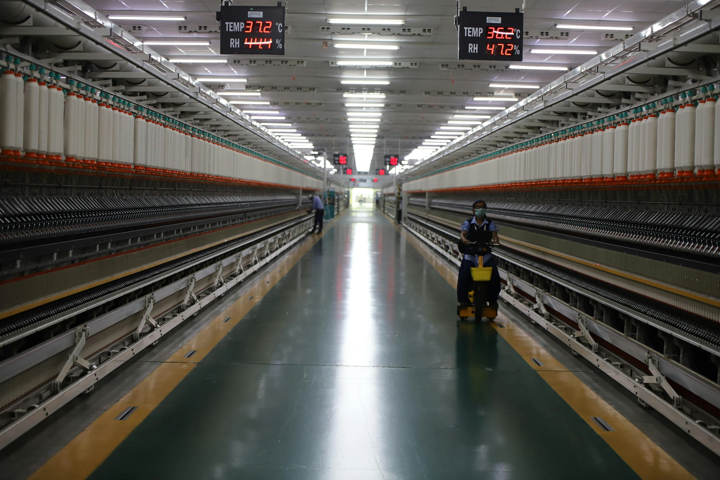 an empty aisle is empty with several benches