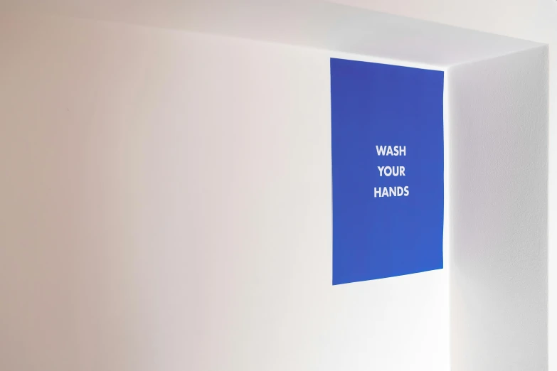 a bathroom with a wash your hands sign on the wall, a poster, inspired by Yves Klein, unsplash, interactive art, three quarter view, john pawson, blue - print, high - angle view