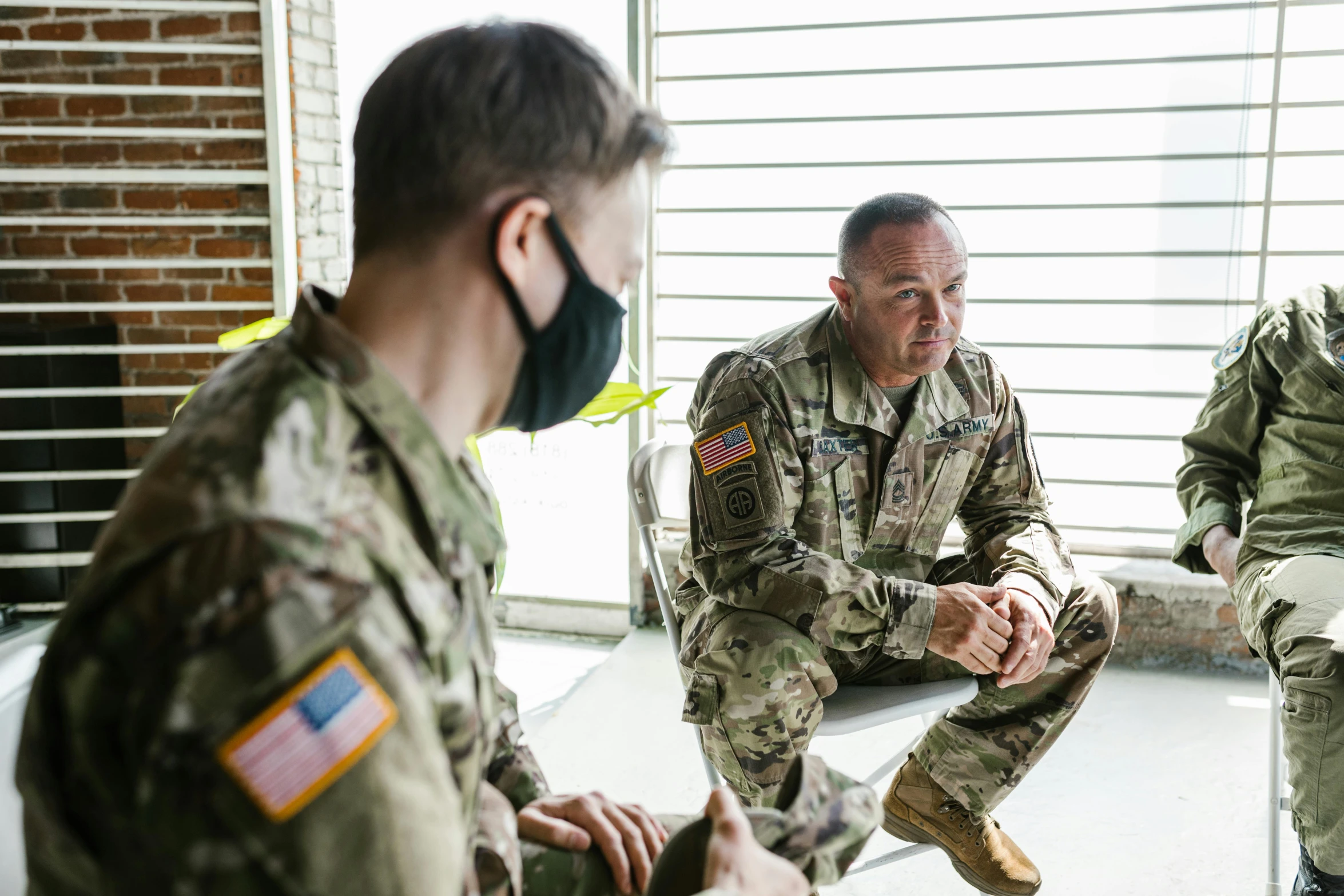 a group of soldiers sitting next to each other, a portrait, pexels, visual art, u.s. national security advisor, avatar image, covid, wearing military uniform