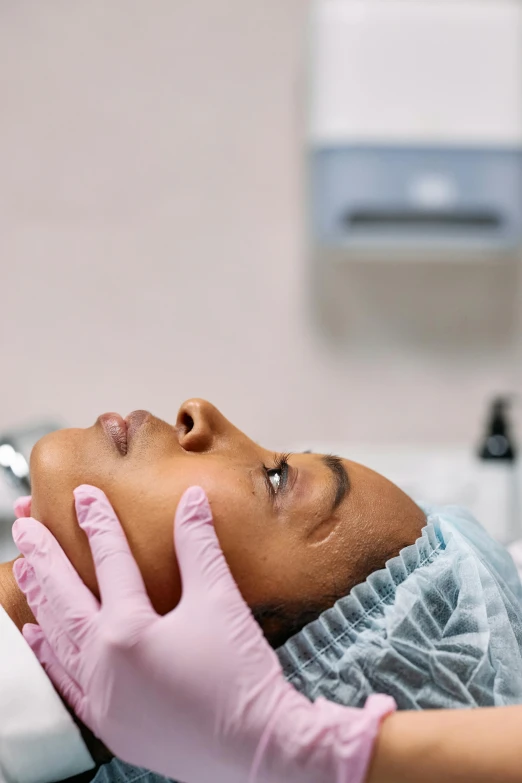 a close up of a person laying on a bed, happening, facial precision, surgical supplies, african american woman, thumbnail