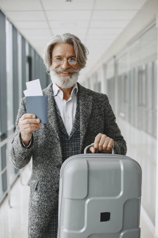 an old man with glasses is holding a passport and suitcase