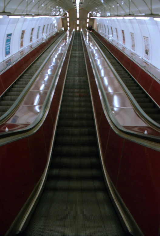 escalator with a red side next to it