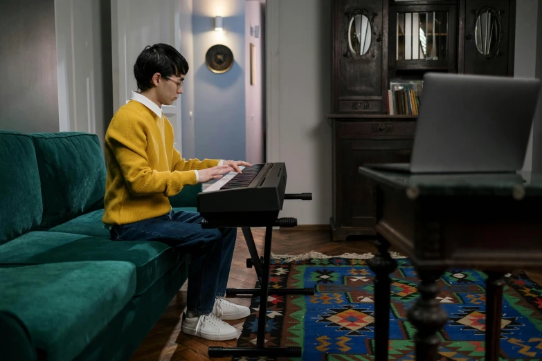 a person sitting on a couch playing a keyboard, fukaya yuichiro, hammershøi, student, at home