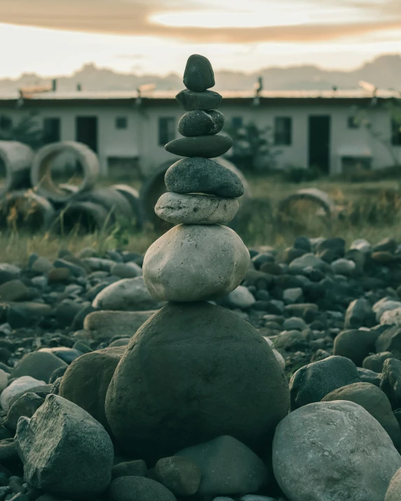 a pile of rocks sitting on top of a rocky beach, a statue, full building, lgbtq, simple shapes, trending photo