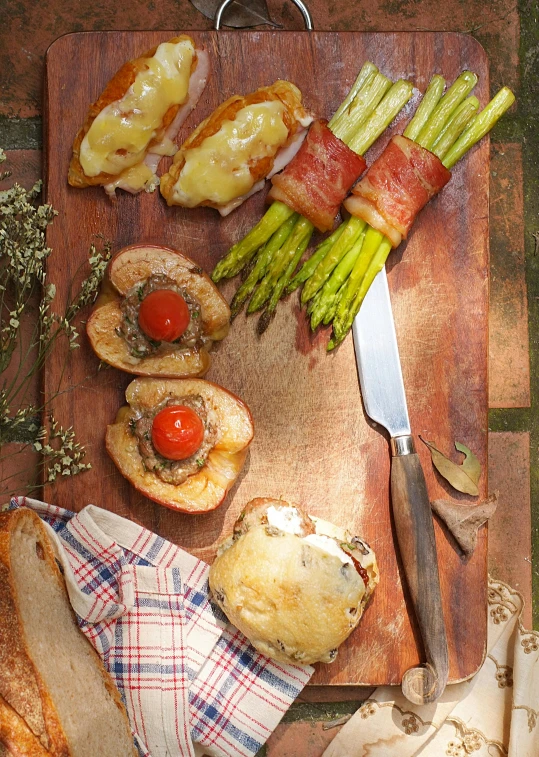 a wooden cutting board topped with different types of food, slide show, french, hillside, full shot