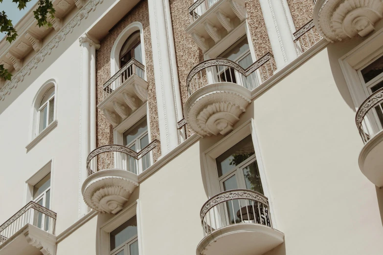 the balconies and wrought iron railings are painted white