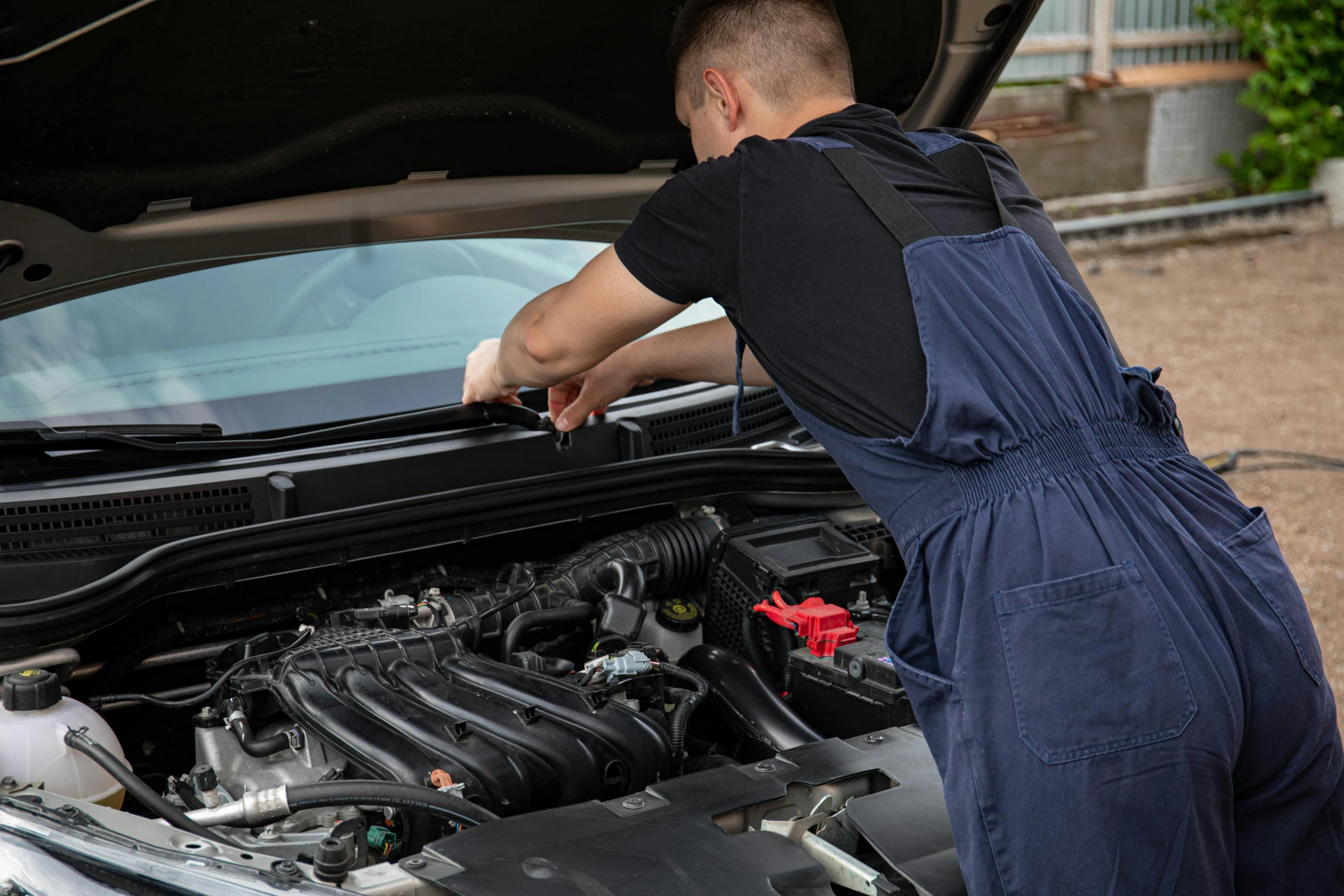 a man fixing the hood of a car, a picture, shutterstock, renaissance, 15081959 21121991 01012000 4k, instagram post, pistons and bolts, medium height