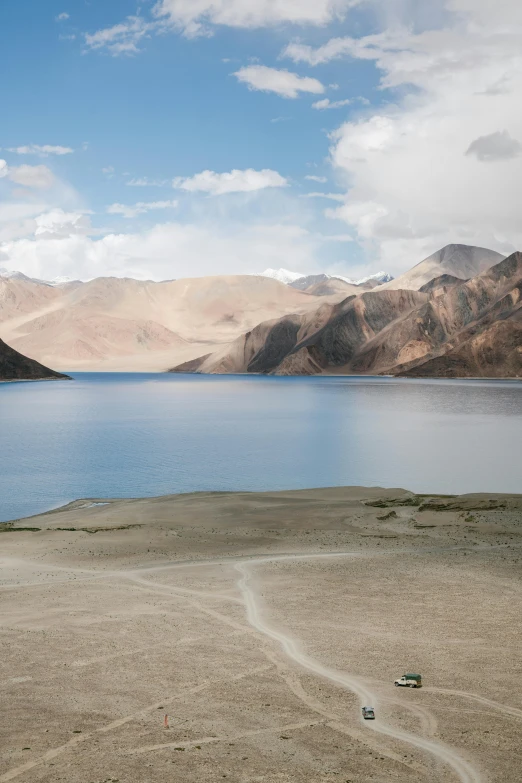 the view of water from an arid mountain range