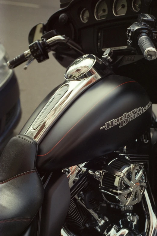 a close up of a motorcycle parked on a street, profile image, gun metal grey, metal chrome, black matte finish