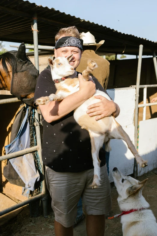 a man holding a dog while standing next to a horse, sam hyde, australian, an ahoge stands up on her head, rex orange county