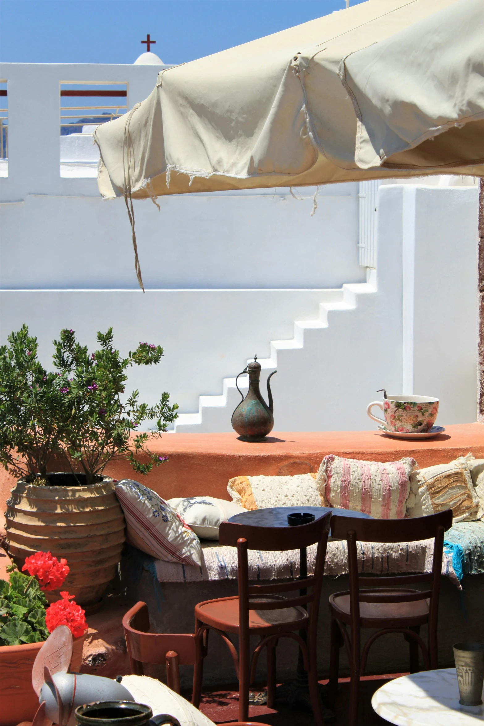 the patio table has many cushions on it