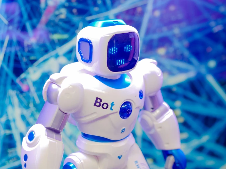 a close up of a toy robot on a table, a hologram, interactive art, with a blue background, bella poarch, biotech, the best
