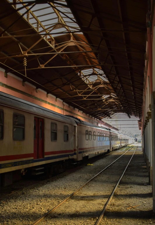 a large long train on a steel track, by Joze Ciuha, canopies, jakarta, indoor picture, square