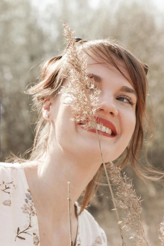 a woman that is standing in the grass, trending on pexels, renaissance, smiling fashion model face, branches sprouting from her head, delicate jaw, joey king