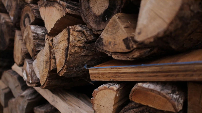 a pile of wood stacked on top of each other, pexels contest winner, profile image, thumbnail, background image, opening shot