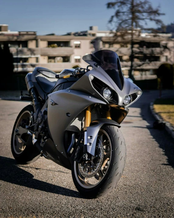 a silver motorcycle parked on the side of the road, pexels contest winner, vantablack gi, front, diablo, brown