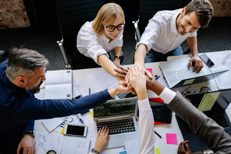 a group of people sitting around a table with laptops, pexels contest winner, hands pressed together in bow, avatar image, hip corporate, lachlan bailey