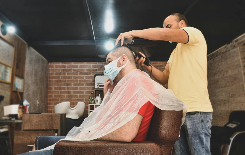 a man getting his hair cut at a barber shop, pexels contest winner, hurufiyya, white man with black fabric mask, thumbnail, 15081959 21121991 01012000 4k, man sitting facing away