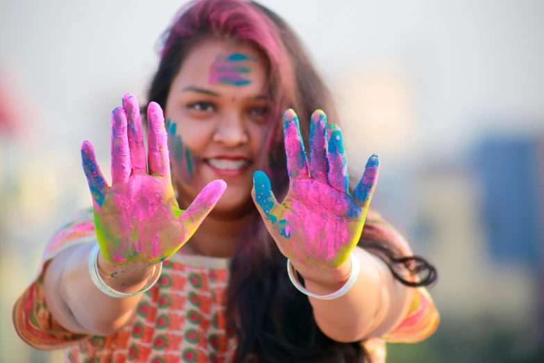 a close up of a person with painted hands, by Julia Pishtar, pexels contest winner, indian, selfie photo, 15081959 21121991 01012000 4k, cheerful colors