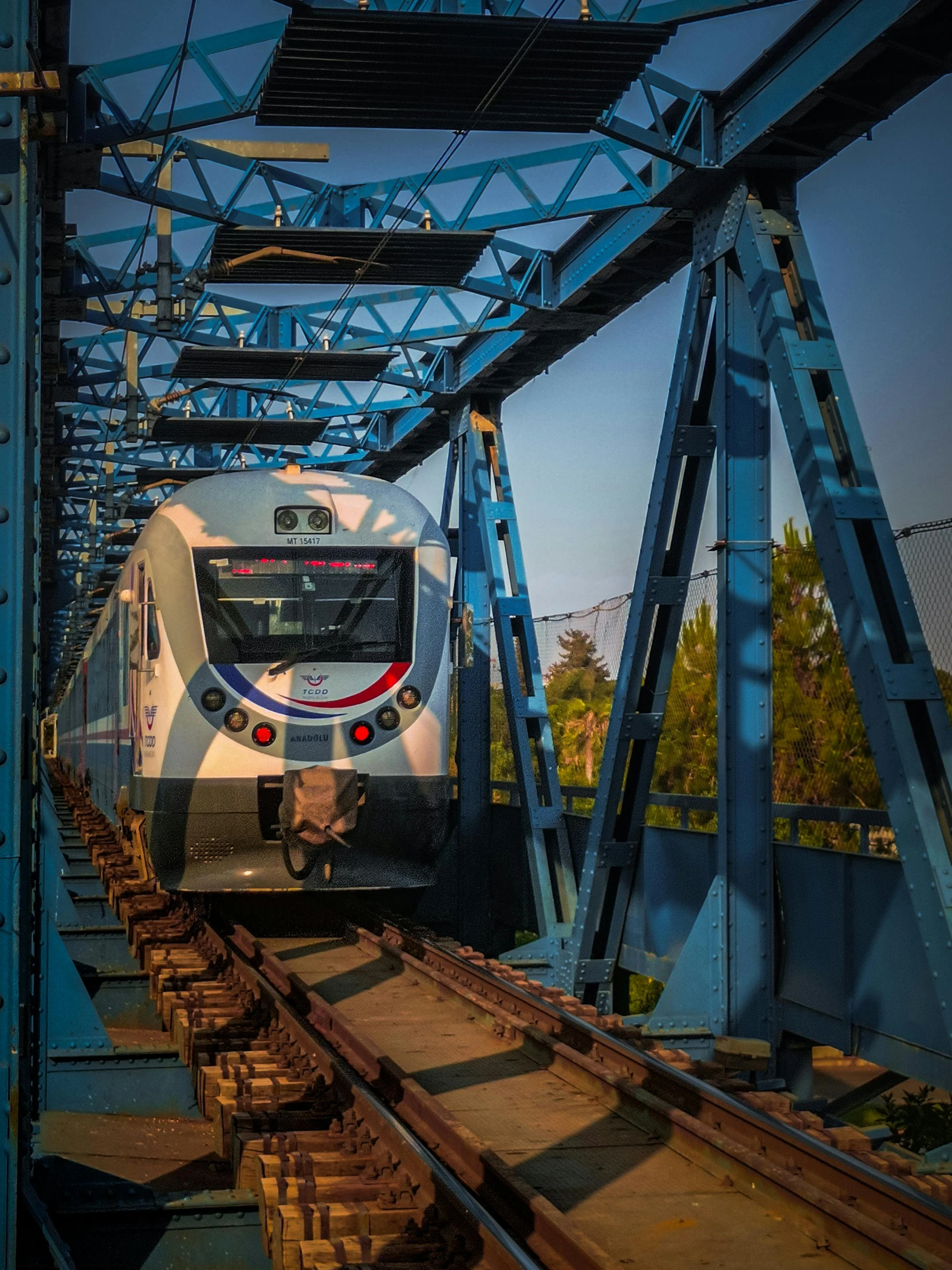 a large long train on a steel track, by Ihor Podolchak, unsplash, renaissance, indore, monorail, full frame image, thumbnail