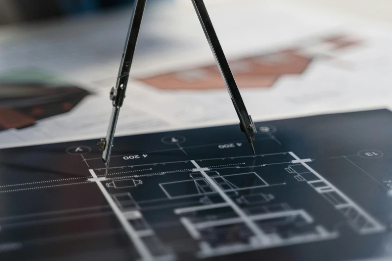 a tablet computer sitting on top of a table, a digital rendering, by Sam Black, unsplash, constructivism, architectural plan, detailed mechanical design, medium close-up shot, measurements