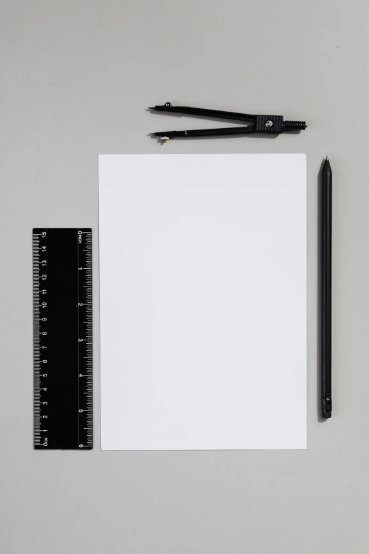 a piece of paper and a ruler on a table, a drawing, by Harvey Quaytman, unsplash, visual art, studio medium format photograph, white sketchbook style, digital matte black paper art, full body image