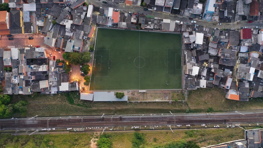 an aerial view of a soccer field in a city, an album cover, by Daniel Lieske, pexels contest winner, location ( favela ), baseball stadium, julia fuentes, no ground visible