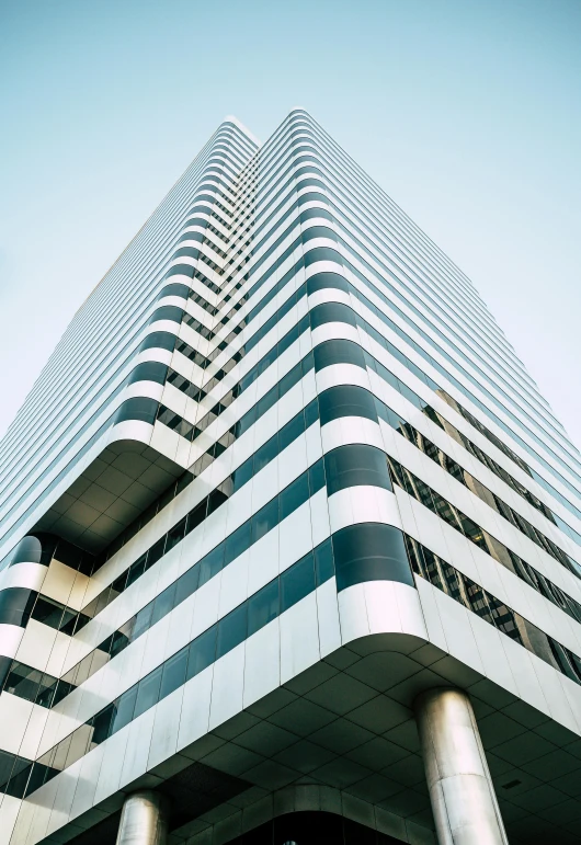 a tall building with black and white stripes, inspired by Ned M. Seidler, unsplash contest winner, square lines, crisp lines and color, a long-shot from front, hyperdetailed