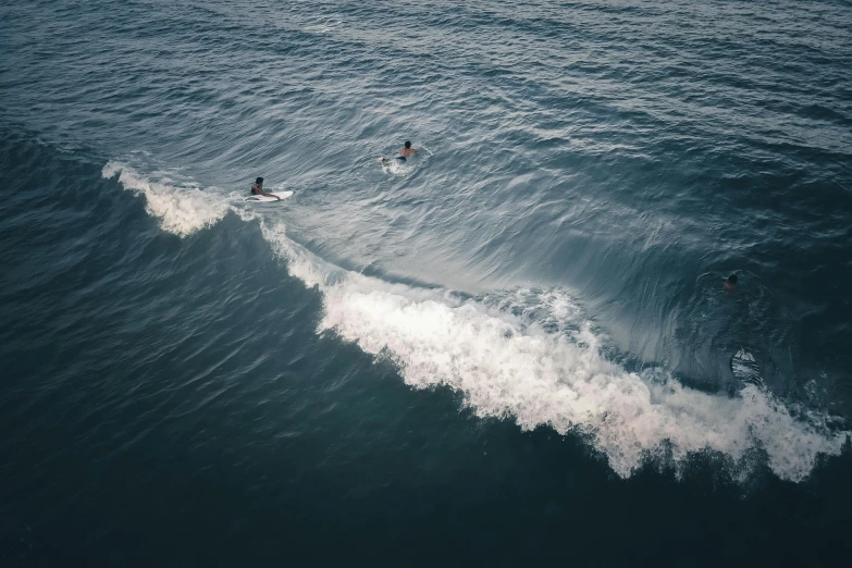 a couple of people riding a wave on top of a surfboard, pexels contest winner, the photo was taken from afar, thumbnail, hd footage, high angle shot