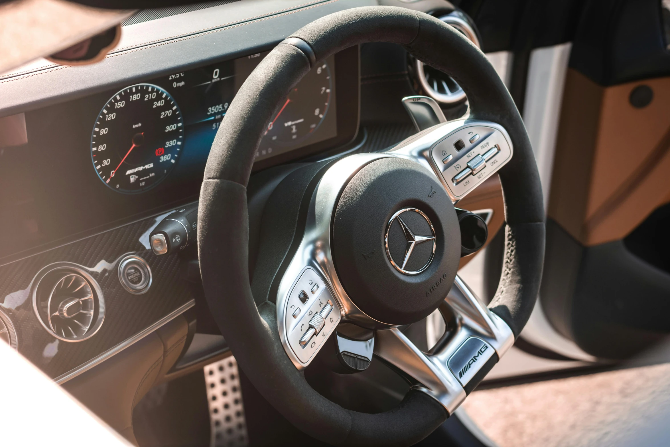 a close up of a steering wheel in a car, mercedes, profile image, rectangle, still photograph